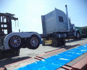 lifting truck onto flat rack