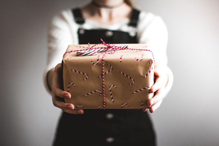 woman-holding-car-accessory-holiday-gift