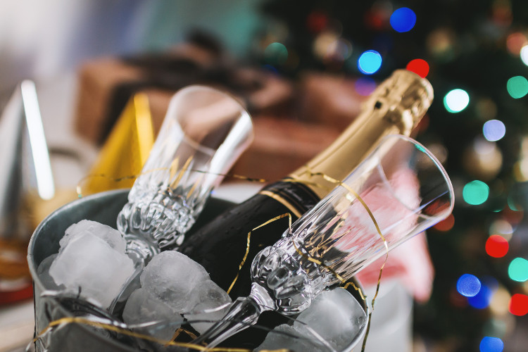 champagne-flutes-bucket for New Year’s Eve Traditions Around the World