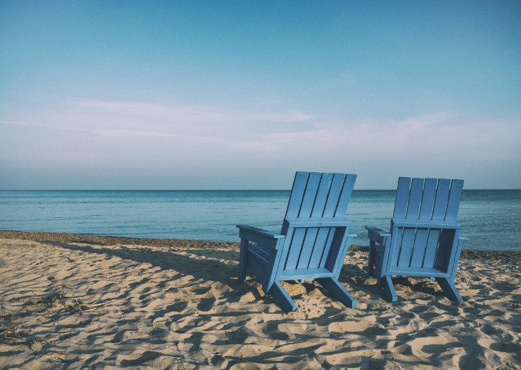 pair of chairs on a beach