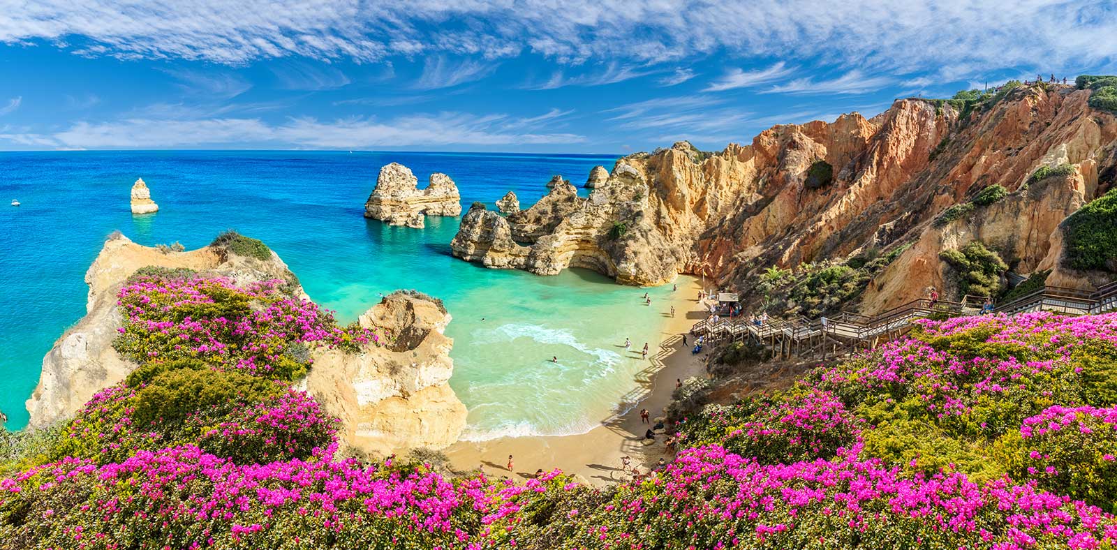 Landscape with Praia do Camilo, famous beach in Algarve, Portugal for expats to retire to