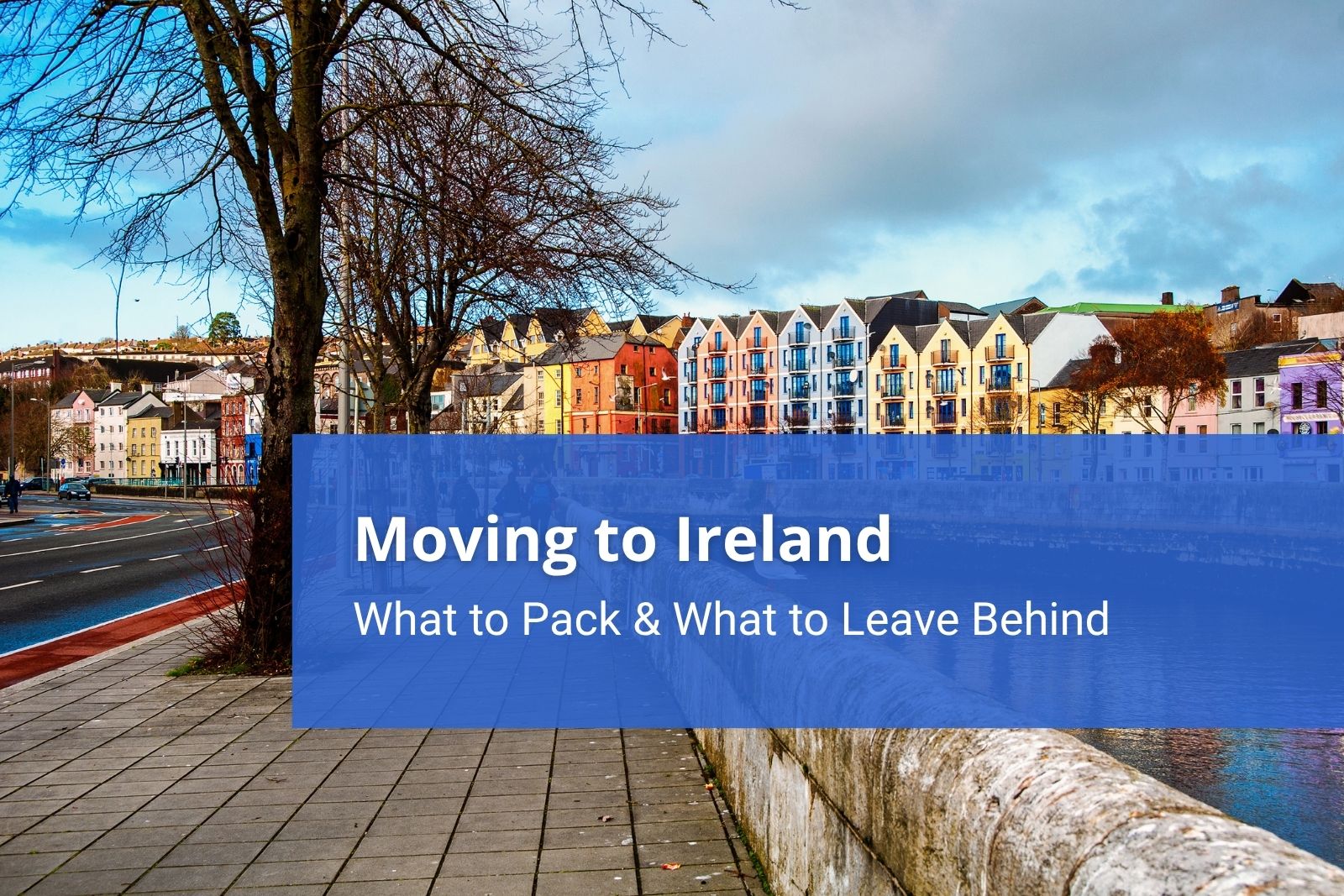 Irish homes pictured along the bank of a river, knowing what to pack when you move here is essential